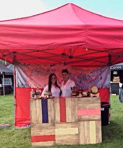 2 members of the event staff team working on a stand at a UK festival