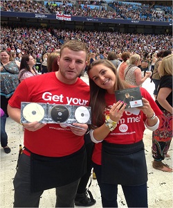 hire-festival-staff Two of our festival promotional event staff with promotional CD's for sale